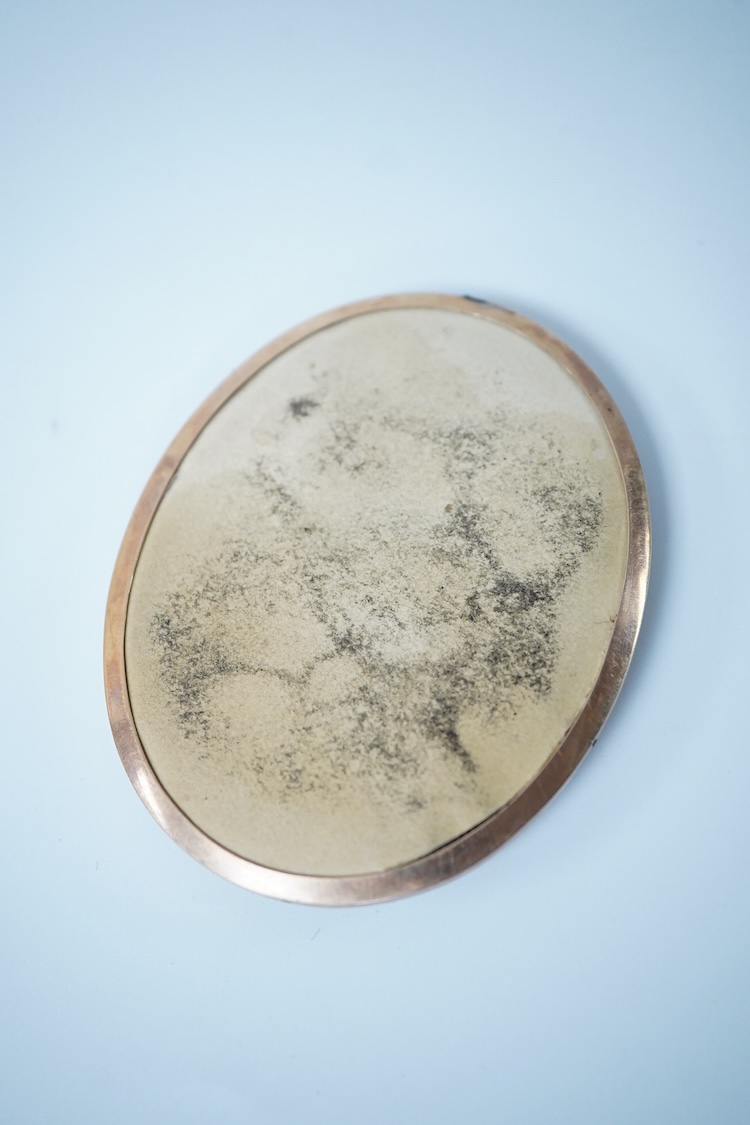 An early 19th century, English School, Portrait of a clergyman, portrait miniature, watercolour on ivory, housed in a gilt metal frame, 7.5cm high CITES Submission reference 2DG4HQ4U
